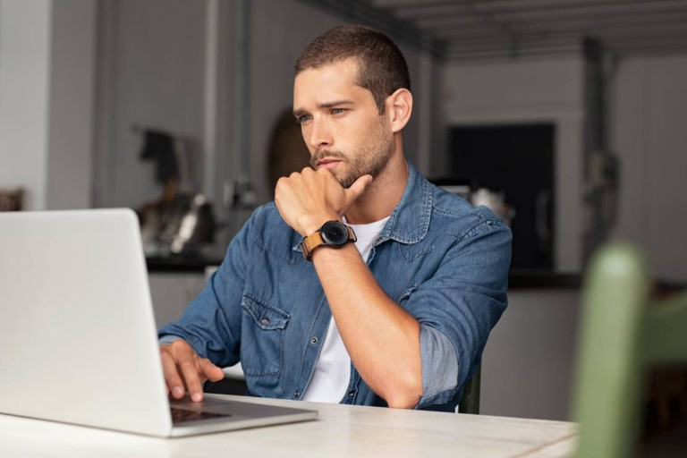 bigstock_Serious_young_man_working_on_l_311566528.b36f5218